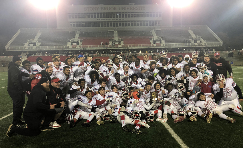 Group shot of Suffolk County division II Championship Bellport Clippers football team